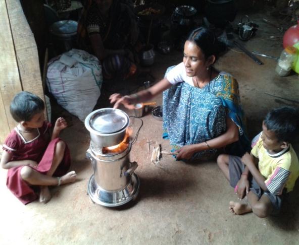  SHG women using Biomass cook stove for cooking   