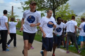 Employees participating in a running-based charity fundraiser
