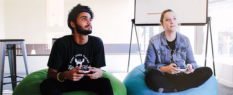 Two members of the DonorDrive staff using Live Fundraising™ at a virtual gaming event to benefit children's hospitals.