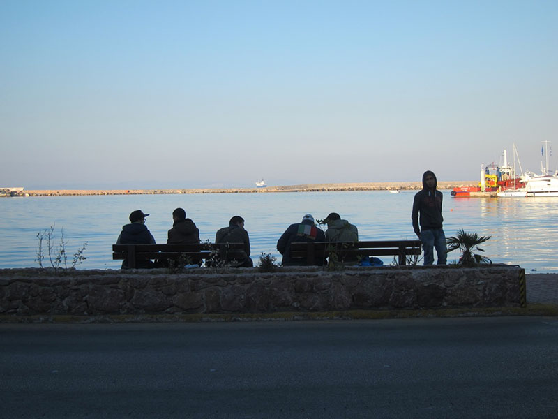 Syrian refugees on Samos Island, Greece awaiting a ferry to the mainland. Photo courtesy of Rakesh Bharania.