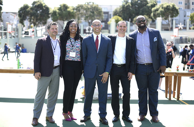 Leaders from Oakland Unified School District, local nonprofits and Salesforce.org at a volunteering day at Presidio Middle School, September 2019