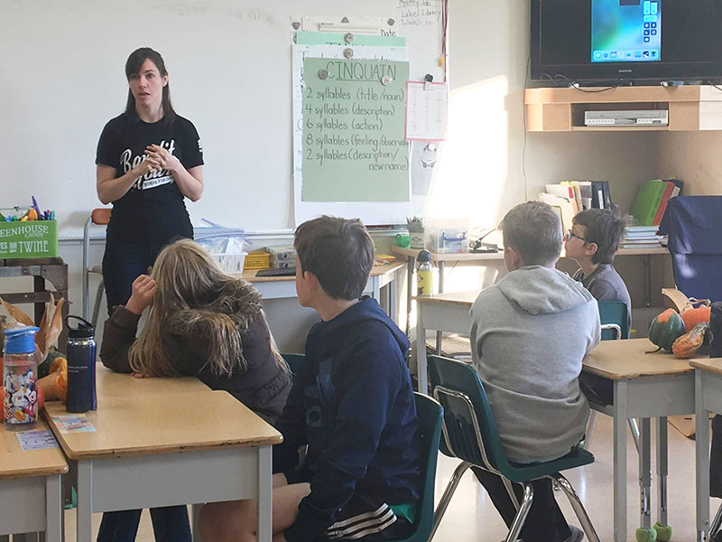 Caitlin Tuba, Data Protection Officer at Traction Guest, teaches code to elementary school kids.