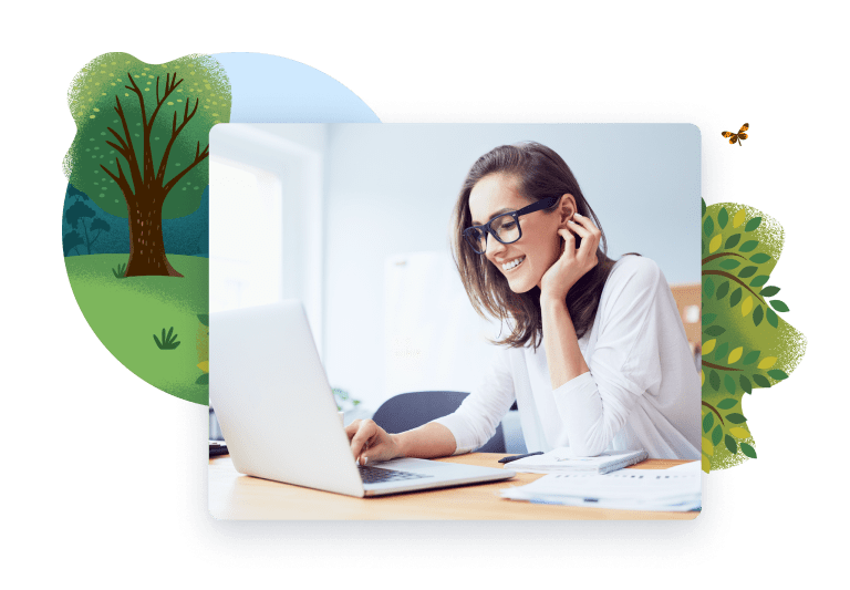 Woman smiling while looking at laptop