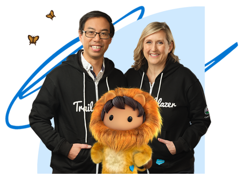 Two Salesforce Trailblazers standing with Lionheart and smiling